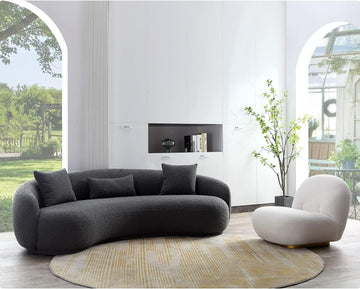 grey curved sofa homio decor with an armchair