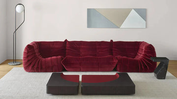 Togo sofa in wine red in cozy living room setting