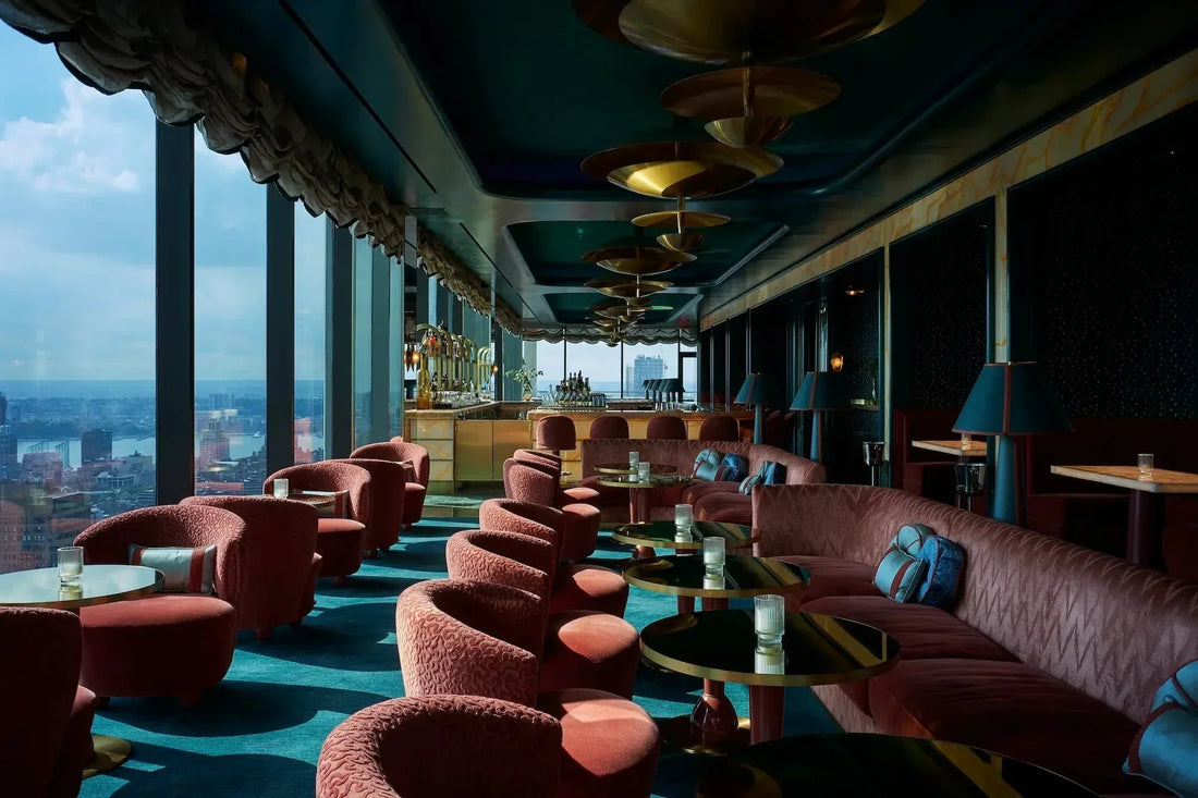 Chic hotel bar area showcasing Art Deco stools and lighting fixtures with vintage flair