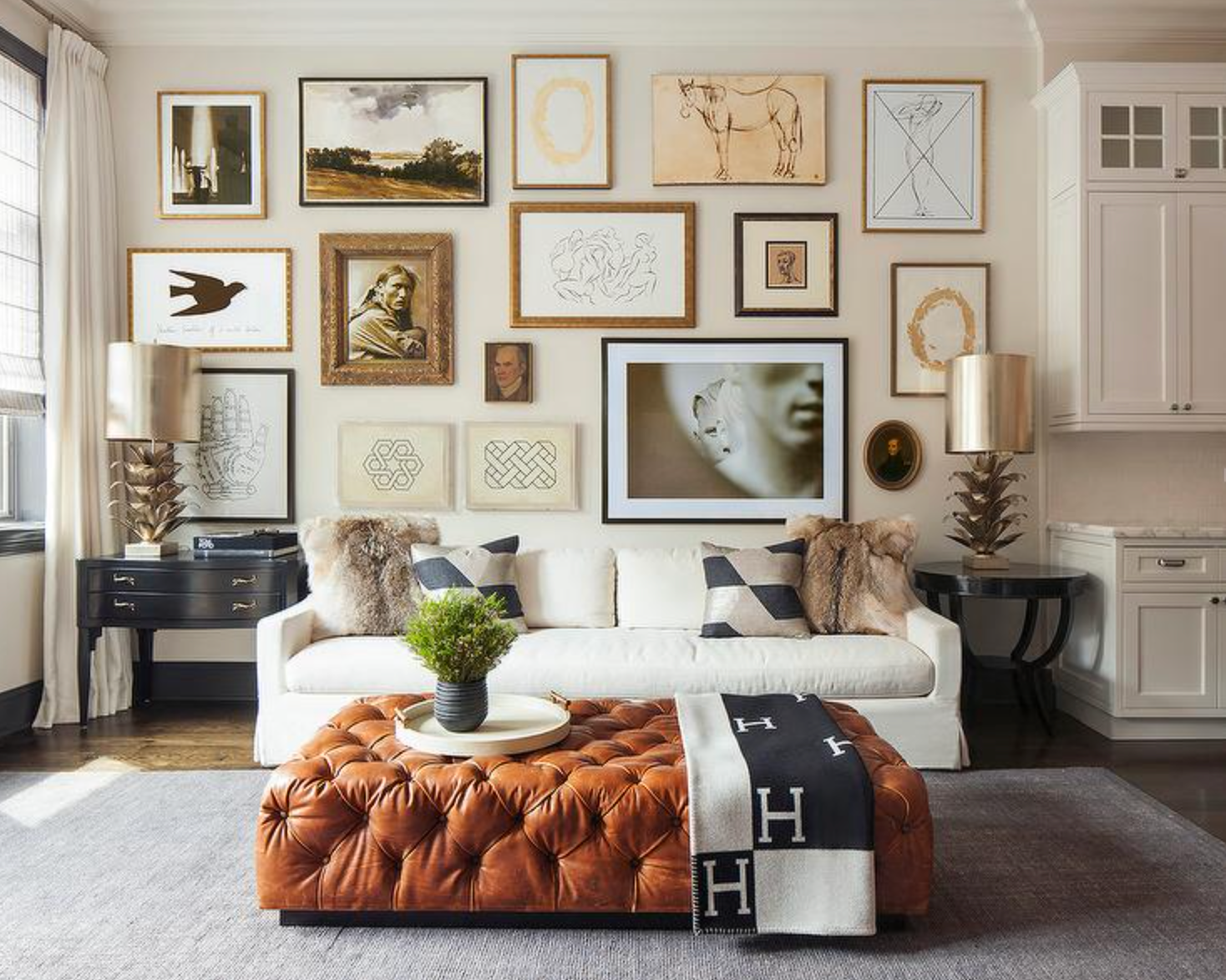 Modern minimalist living room featuring sleek Homio Decor furniture and hermes H black blanket