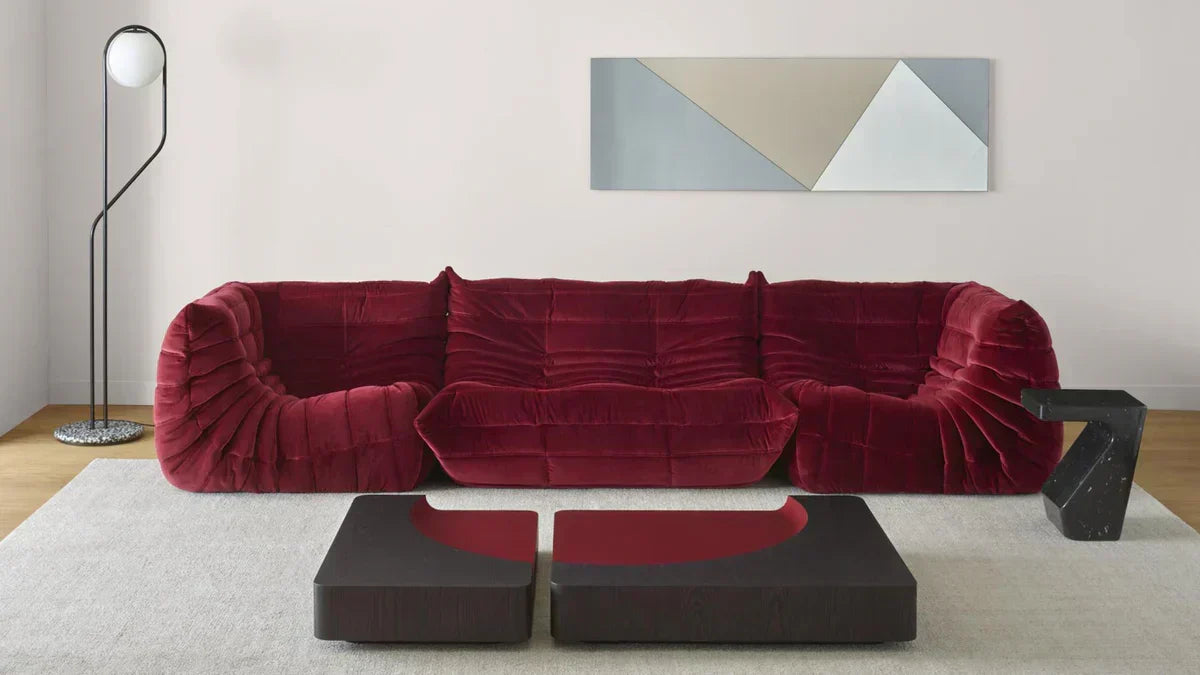 Togo sofa in wine red in cozy living room setting