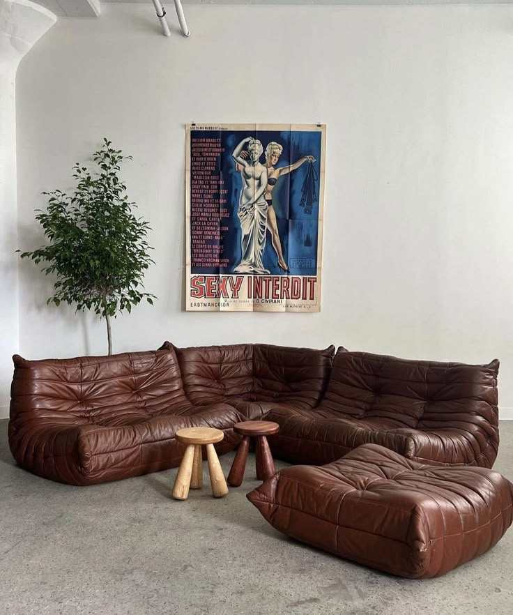brown leather Togo sofa with pleated modular form in neutral room setting