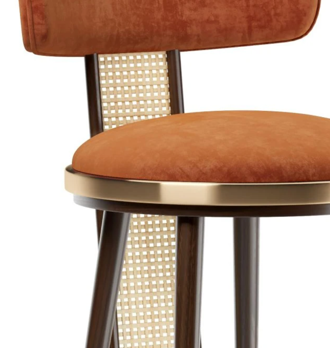 Close-up of a brown velvet bar stool with a metal frame on a white background