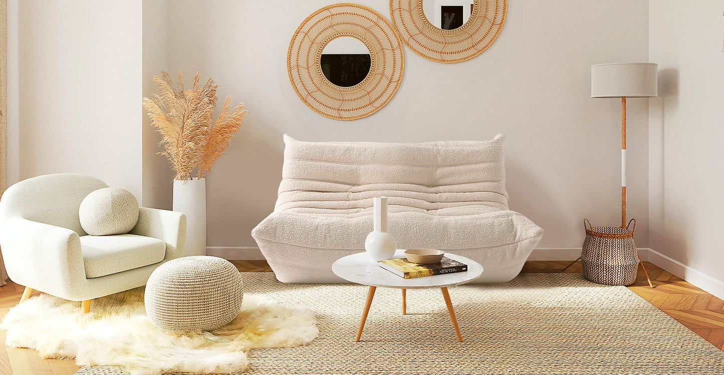 boucle off white low profile sofa in a scandinavian interior design 