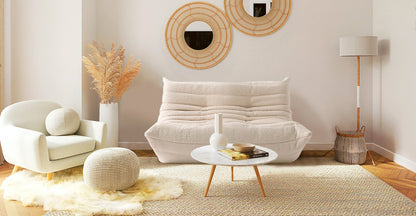 boucle off white low profile sofa in a scandinavian interior design 