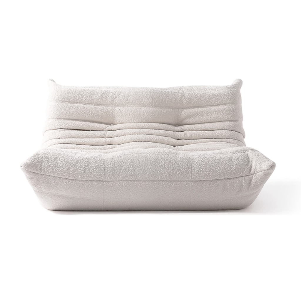 boucle off white low profile sofa in a white background close up shot fabric two seater sofa