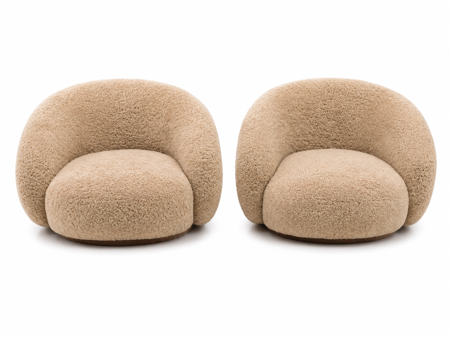 A pair of modern, rounded shearling armchairs in a warm beige/tan color, shown side-by-side against a plain white background.