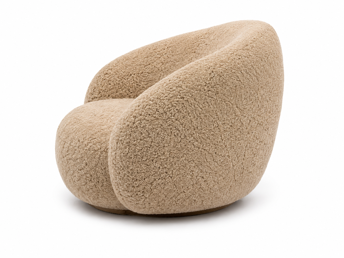 A modern, low-profile barrel chair upholstered in a genuine sheepskin or sherpa fabric in a warm beige/tan color, shown against a plain white background.